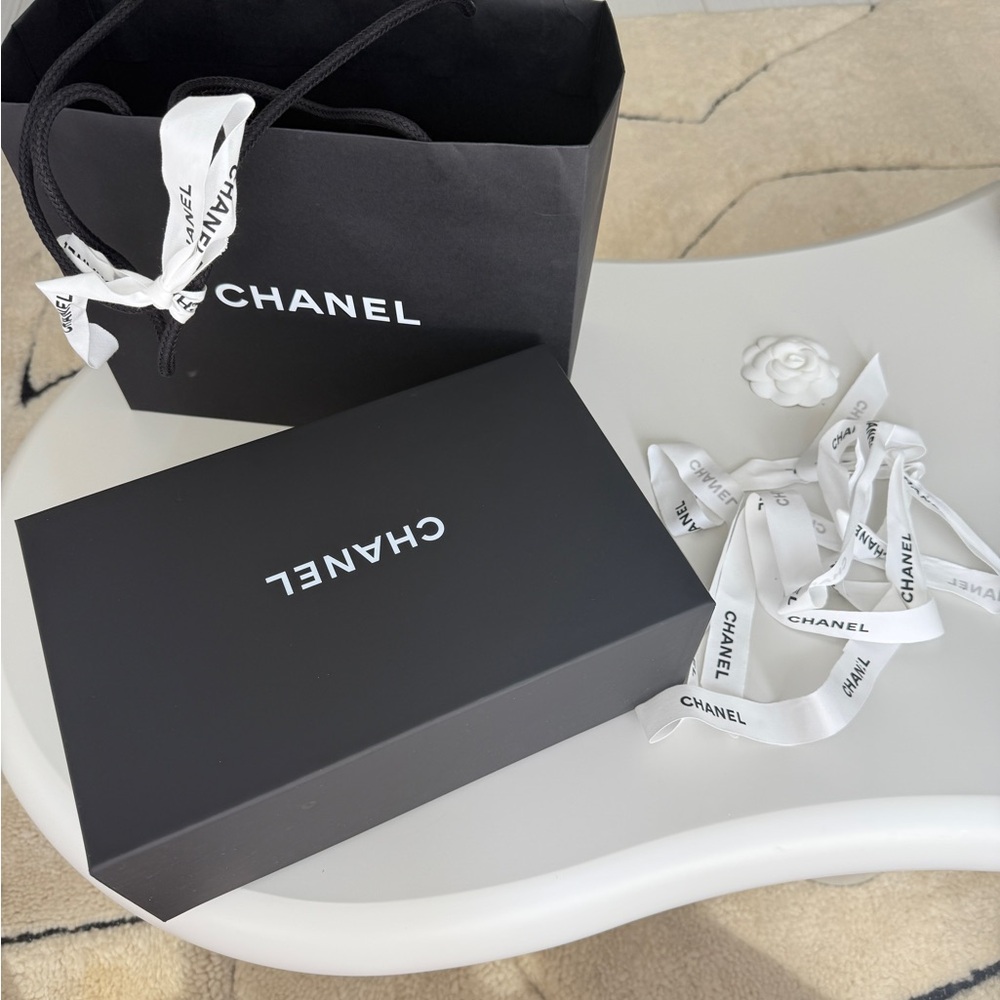 CHANEL box and bag with ribbons and a camellia and a dust bag